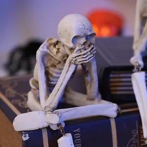 Detailed macro view of a miniature resin skeleton figurine for spooky Halloween table decor.