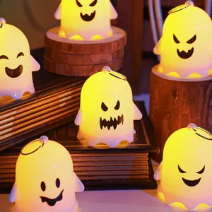 Close-up of glowing cute Halloween ghost night lights for spooky party room decorations