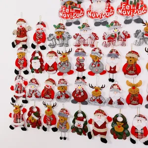 Diverse collection of festive plush Christmas ornaments featuring Santa and reindeer designs.