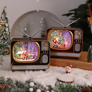 Vintage Christmas TV snow globe music box with festive Santa and glowing lights