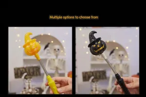 Close-up of yellow and black glowing Halloween pumpkin wands with spring handles