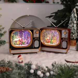 Two vintage TV-style Christmas music boxes with colorful LED lights and swirling snow