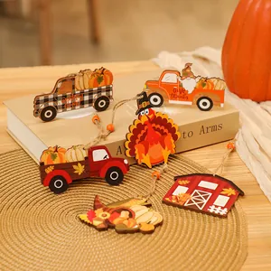 Detailed view of Thanksgiving wooden ornaments including turkey and pumpkin trucks