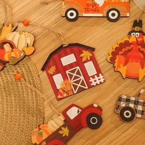 Detail shot of hand-painted wooden Thanksgiving harvest charms on rustic wood background