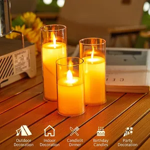 Set of three flameless LED electronic candles in glass jars for warm decorative lighting