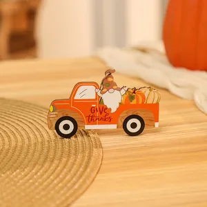 Close-up of Harvest gnome truck wooden ornament with festive Give Thanks engraving