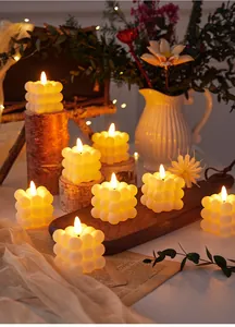 Romantic bubble cube LED candles providing a warm glow for decorative atmosphere