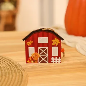 Detailed view of a red barn wooden hanging ornament for Harvest and Thanksgiving decor
