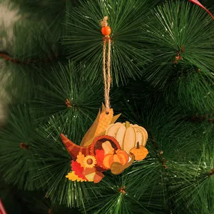 Close-up of wooden harvest festival ornament with pumpkin and cornucopia details