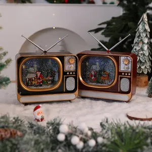 Two retro Christmas TV snow globe music boxes with festive Santa and reindeer scenes.