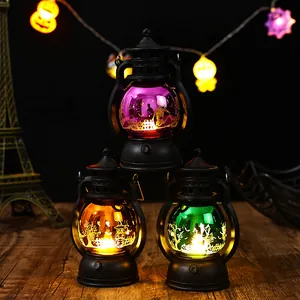 Halloween decoratieve lantaarns met paars oranje en groen gloeiende laserpatronen