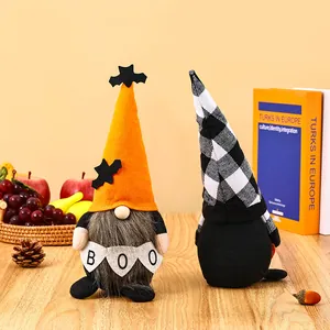 Detailed view of Halloween faceless gnomes with BOO banner and bat hat decorations