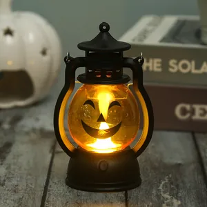 Detail shot of a glowing Halloween pumpkin lantern with a warm classic smiling face