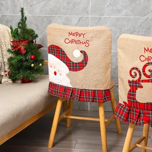 Detailed view of Christmas burlap chair covers featuring Santa and Reindeer embroidery