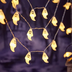 Halloween LED string lights with warm glowing cute smiling ghost figures for decor.