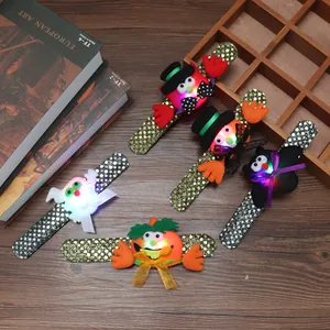 Detailed view of Halloween glowing sequin slap bracelets in various spooky designs