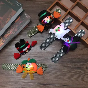 Glowing Halloween slap bracelets with sequins featuring pumpkin, bat and ghost designs