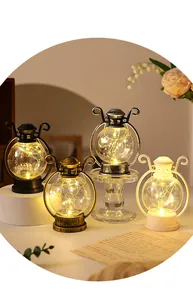 Juego de cuatro farolillos LED vintage con luces cálidas para ambiente decorativo de Navidad