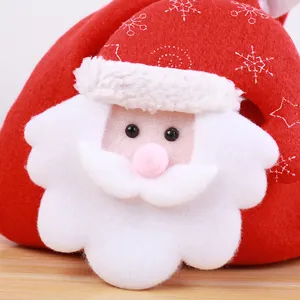 Festive red felt Christmas candy bag with 3D Santa Claus face and white snowflake pattern