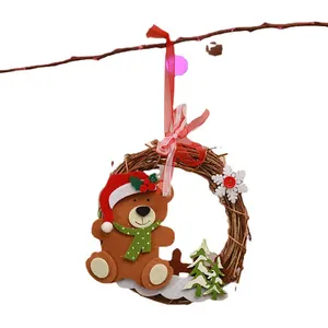 Handmade Christmas rattan wreath with festive felt bear and snowflake decoration