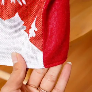 Detailed close-up view of durable burlap texture and white stitching on a Santa chair cover