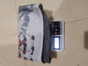 Close-up showing the 82g weight of a cartoon Santa Claus Christmas chair cover on a scale