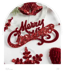 Close-up of red flocked Merry Christmas hanging ornament with sequins