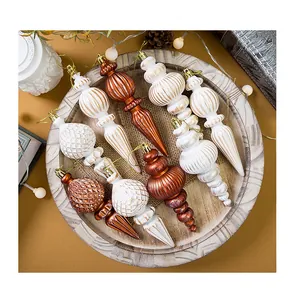 Detail of 16cm vintage Christmas cone ornaments set on a rustic circular wooden tray.