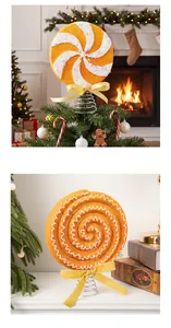 Close-up of Christmas lollipop tree topper with swirl texture and yellow ribbon