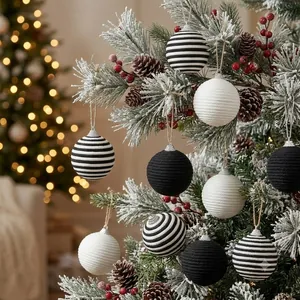 Detailed texture of hand-woven black and white striped knitted Christmas ornaments