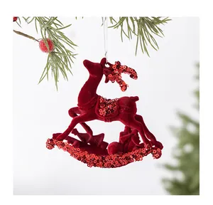 Detail shot of red flocked reindeer Christmas ornament with shiny sequins decoration