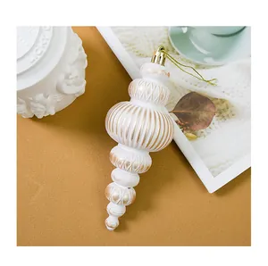 Elegant vintage white and gold spindle Christmas ornament for holiday tree decoration