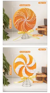 Detailed view of orange lollipop Christmas tree topper showing dimensions and weight data