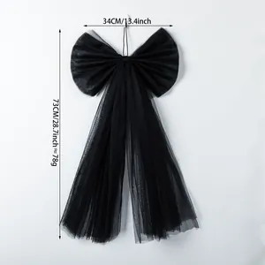 Large black tulle bow Christmas tree topper with size measurements 34cm x 73cm