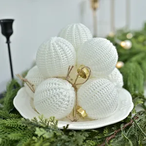 Elegant white knitted Christmas ball ornaments in Nordic style set for tree decoration