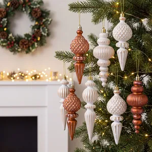 Set of 6 vintage white and bronze 16cm Christmas finial ornaments hanging on a tree.