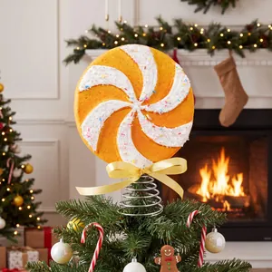 Giant lollipop Christmas tree topper with orange swirl and yellow ribbon decoration