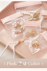 Juego de bolsas de joyería transparentes rosas para protección contra el polvo