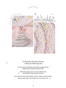 Close-up detail of a pink Christmas candy ornament with colorful foam beads and ribbon.