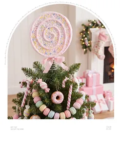 Detailed close-up view of pink foam lollipop tree topper with pastel candy ornaments set