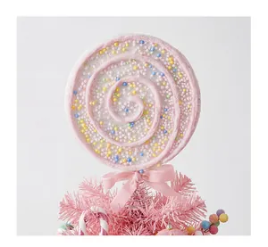 Detailed view of pink foam lollipop Christmas tree topper with colorful mini beads