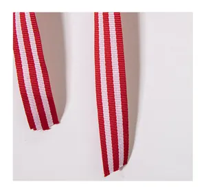 Macro detail view of red and white striped ribbons for Independence Day party decorations.