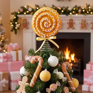 Festive spiral lollipop Christmas tree topper with matching candy ornaments on a tree.