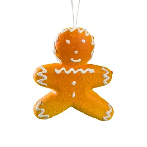 Decorazione per albero di Natale a forma di pan di zenzero con dettagli bianchi.