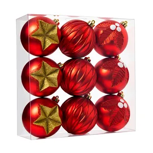 Set of 9 red Christmas ball ornaments with gold stars and holly patterns in a clear box