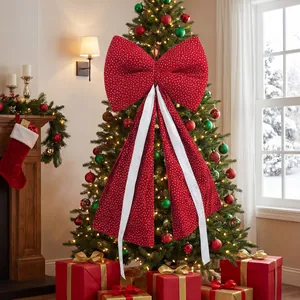 Large red Christmas tree bow with silver streamers in a festive holiday setting