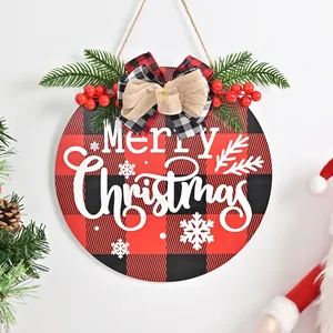 Festive buffalo plaid Christmas door hanging wooden sign with red berries and bow.