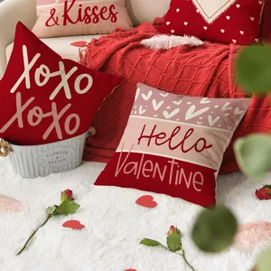Red and pink Valentine's Day heart pillowcases in a romantic home scene setting