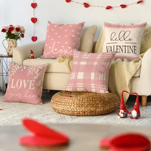 Set of Valentine's Day decorative pillowcases with heart patterns in a cozy living room