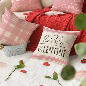 Set of Valentine's Day pillowcases with heart and love motifs in cozy room setting
